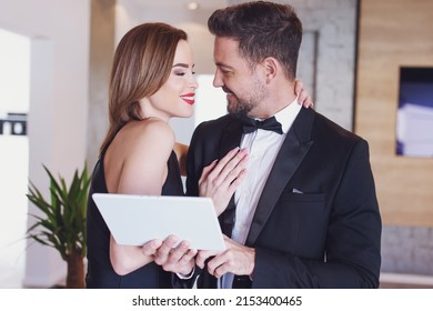 Happy Young Woman Thankful To Rich Boyfriend For Online Shopping By Tablet