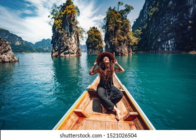 Happy Young Woman Tourist In Asian Hat On The Boat At Lake 
