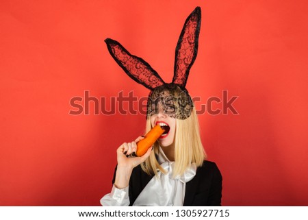 Similar – Young woman wearing rabbit ears and kissing