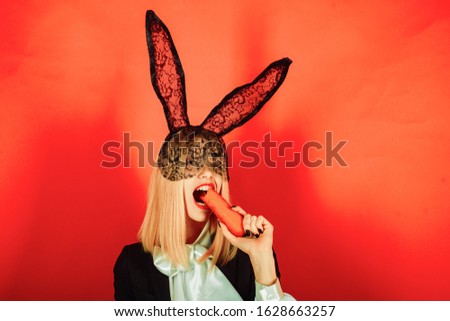 Similar – Young woman wearing rabbit ears and kissing