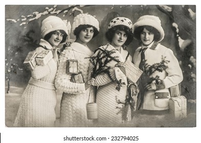 Happy Young Women With Gifts And Christmas Tree. Vintage Picture With Original Film Grain And Blur