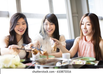 happy young Women group  Eating hot pot 