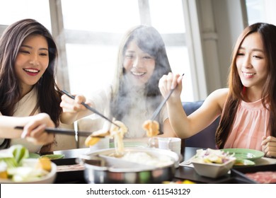 happy young Women group  Eating hot pot 