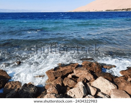 Haql beach is a wild beach covered with light beige sand a prime location for a variety of nautical activities such as rafting, swimming and diving in the turquoise waters of Sultaniyah beach, 