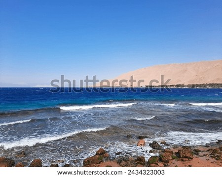 Haql beach is a wild beach covered with light beige sand a prime location for a variety of nautical activities such as rafting, swimming and diving in the turquoise waters of Sultaniyah beach, 