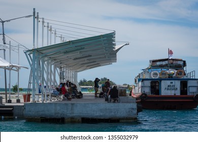 Harapan Island, Jakarta, Indonesia - December 25, 2017 : A traditional wooden ship "KM MILES" is docked at the island of Harapan island and prepares to take passengers back to Jakarta