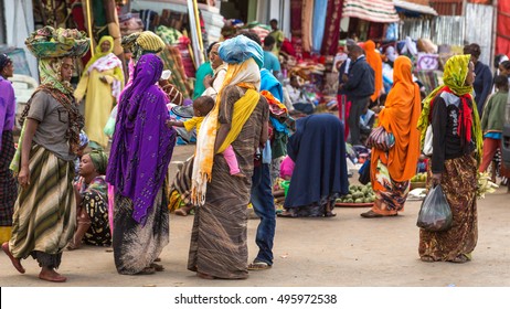 HARAR, ETHIOPIA - JULY 27,2014 - Local residents of Harar,considered as the fourth holy city of Islam, shopping in the street markets near the famous Shoa gate area.