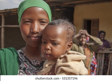 HARAR, ETHIOPIA - MARCH 27: Unidentified Muslim woman poses with her baby in Harar, Ethiopia on March 27, 2012. Harar is the center of Islamic culture in Ethiopia.