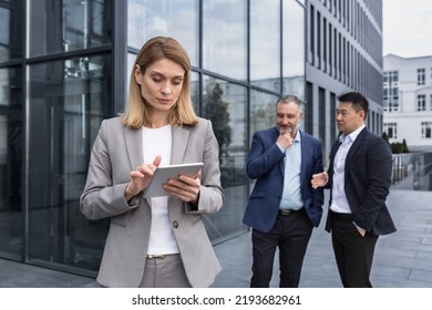 Harassment At Work, Group Of Business People Outside Office Building, Men Discussing Behind Woman Boss's Back, Gossiping And Stalking