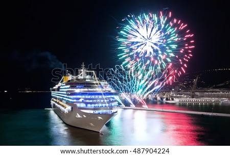Harbor and cruise ship at colorful sunset with fireworks in Trieste, Italy