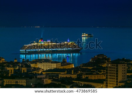 Harbor and cruise ship at night in Trieste, Italy