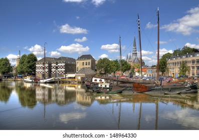 Harbor Of Gouda, Holland With Historical Houses And Boats