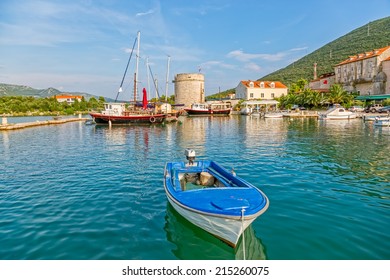 Harbor In Mali Ston And Remains Of The Ancient Walls And Fortress On Peljesac Peninsula.