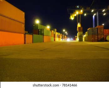 Harbor Of Shipping Containers At Night