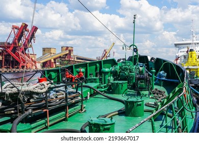 Harbor View With A Closeup Fragment Of The Green Forward Deck Of A Small Ship