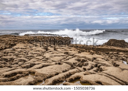 Harbour beach with waves and rocks, Doolin, Clare, Ireland