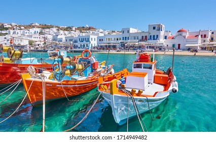 Harbour with wooden fishing boats in Chora town on sunny summer day, Mykonos island, Greece -- Greek landscape - Shutterstock ID 1714949482