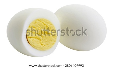 Hard boiled egg cut in half showing yellow yolk and white albumen