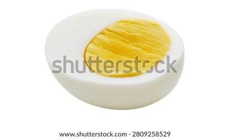 Hard boiled egg half with smooth white albumen and textured yellow yolk