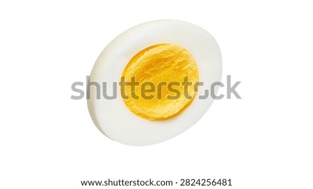 Hard boiled egg slice with bright yellow yolk and smooth white albumen