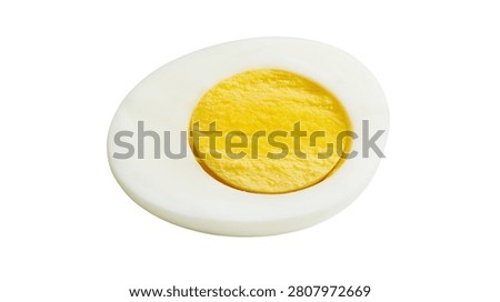 Hard boiled egg slice showing white albumen and yellow yolk center