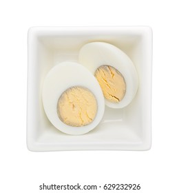 Hard Boiled Egg In A Square Bowl Isolated On White Background
