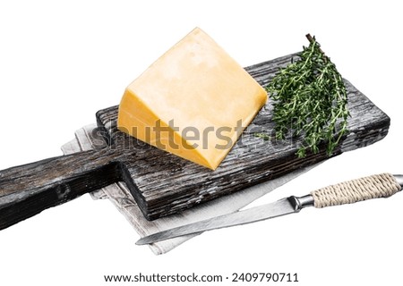 Hard cheese with knive on wooden cutting board. Parmesan Isolated on white background, top view