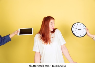 Hard Choice. Caucasian Young Woman's Portrait On Yellow Studio Background, Too Much Tasks. How To Manage Time Right. Concept Of Office Working, Business, Finance, Freelance, Self Management, Planning.