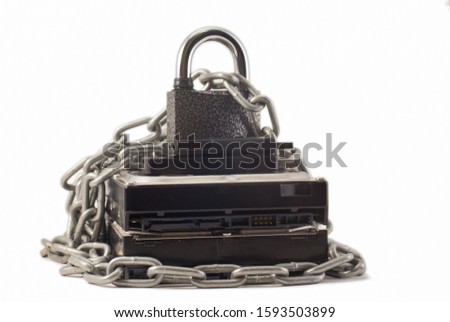 Hard disk, chain and padlock on a white background. The lock is locked.