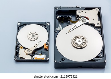 Hard disk drive and open cover. Computer hardware, hard disk, storage device. Detail of the inside of a hard disk drive. Hard disk is internal mechanism hardware