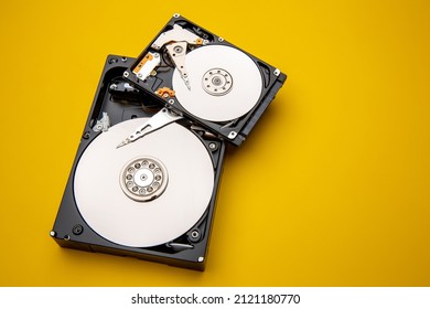 Hard disk drive and open cover. Computer hardware, hard disk, storage device. Detail of the inside of a hard disk drive. Hard disk is internal mechanism hardware - Shutterstock ID 2121180770