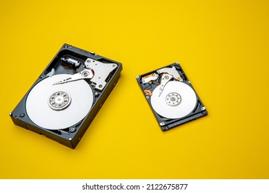 Hard disk drive and open cover. Computer hardware, hard disk, storage device. Detail of the inside of a hard disk drive. Hard disk is internal mechanism hardware