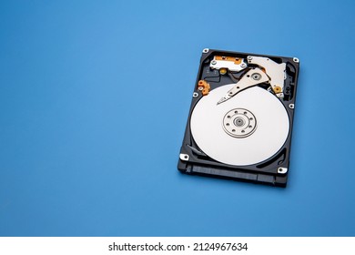 Hard disk drive and open cover. Computer hardware, hard disk, storage device. Detail of the inside of a hard disk drive. Hard disk is internal mechanism hardware - Shutterstock ID 2124967634