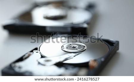 Hard drive from computer or laptop lies on the table in the repair shop. Performs fault diagnostics and performs urgent repairs recovery of lost data during deletion HDD closeup