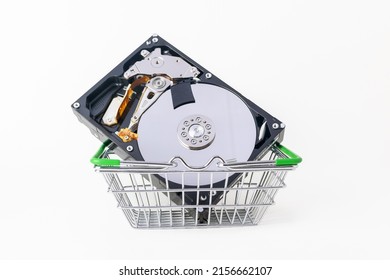 Hard drive in the shopping cart on a white background, HDD disk, memory device. The concept of repairing, buying, selling a harddrive for a computer or laptop. Storage and recovery of digital data.