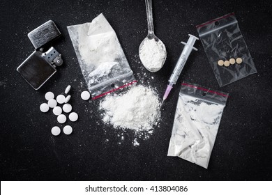 Hard drugs on dark table