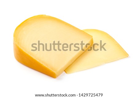 Hard Dutch gouda cheese, close-up, isolated on white background.