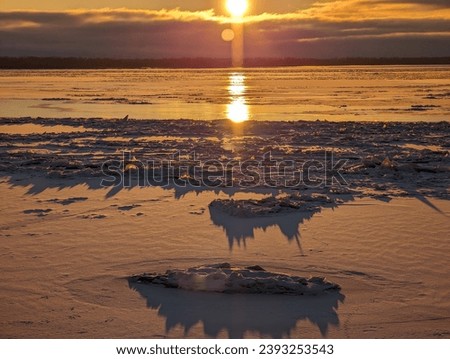 Hard frost. Sunset over the frozen river. High quality photo