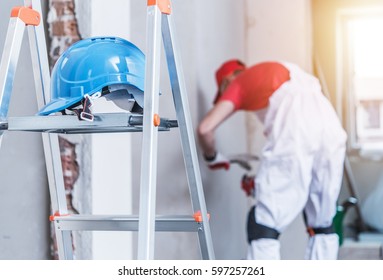 Hard Hat Left On The Ladder. Construction Safety Concept.