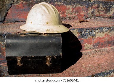 Hard Hat And Old Metal Lunchbox