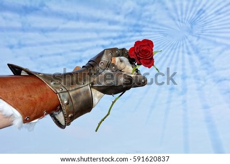 Hard but hearty  -  iron knight's hand with red rose before blue sky with lighteffect