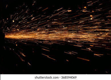 Hard job  with  sparks from abrasive grinder circle