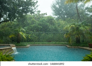 Hard Rain Falling In Backyard Pool On A Very Rainy Day