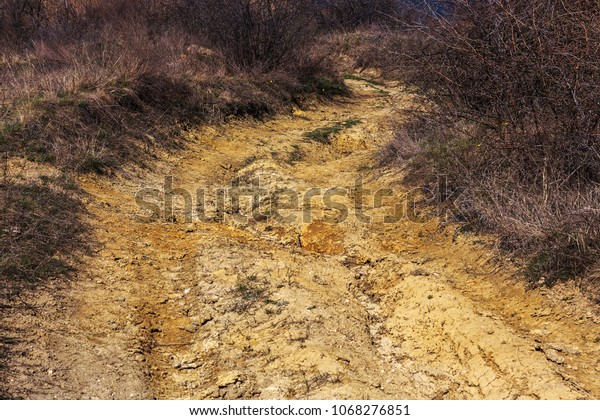 Hard road in the mountains. Ground road\
off-road for rallying. Mountain outside the\
road