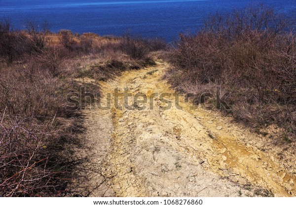 Hard road in the mountains. Ground road\
off-road for rallying. Mountain outside the\
road