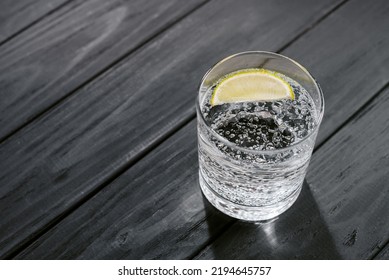 Hard Seltzer With Lime On A Dark Wooden Background