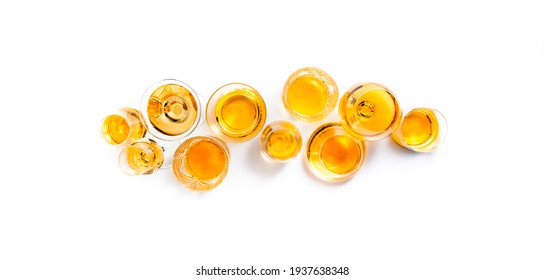 Hard Strong Alcoholic Drinks, Spirits And Distillates In Glasses: Vodka, Cognac, Tequila, Scotch, Brandy And Whiskey, Grappa, Vermouth, Rum. White Background 