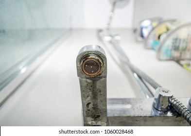 Hard Water Deposit And Rust On Shower Tap