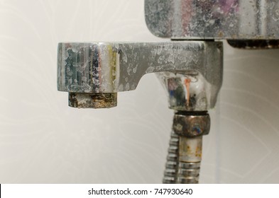 Hard Water Deposit And Rust On Shower Tap