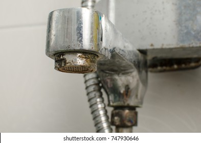 Hard Water Deposit And Rust On Shower Tap